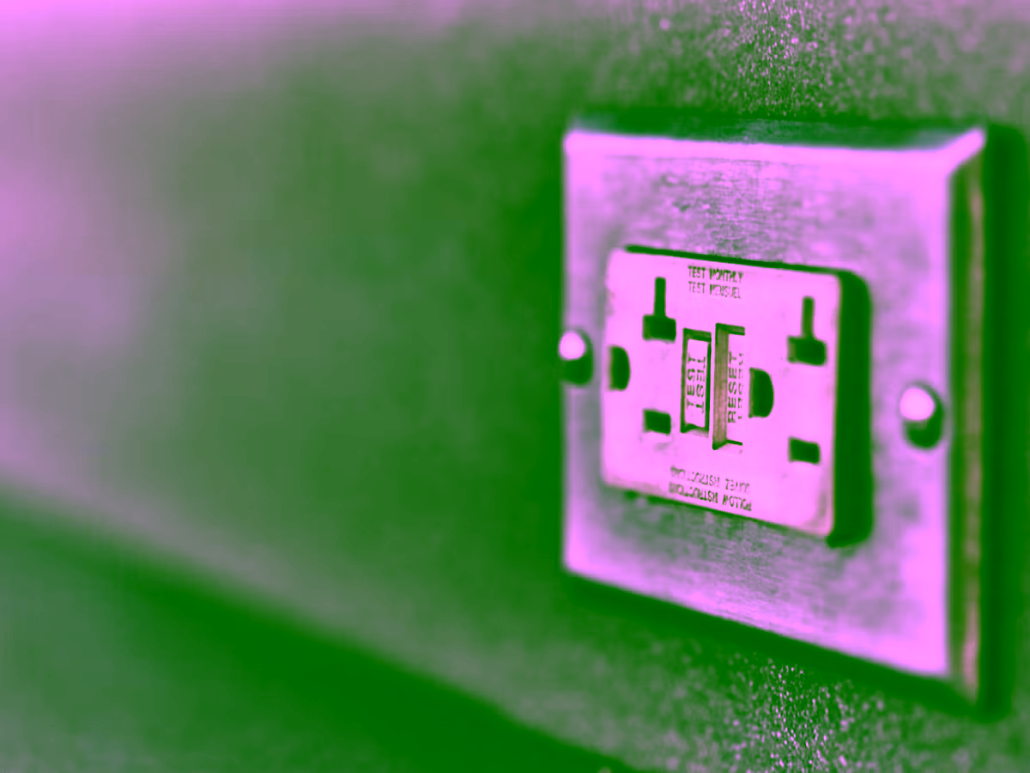 Close-up of a Class A GFCI outlet with test and reset buttons