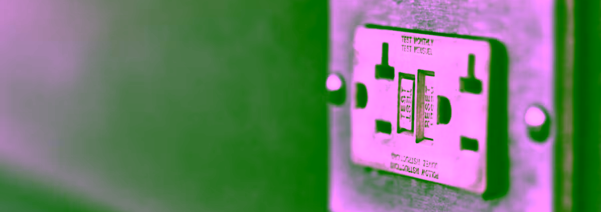 Close-up of a Class A GFCI outlet with test and reset buttons