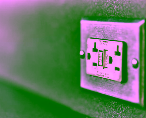 Close-up of a Class A GFCI outlet with test and reset buttons