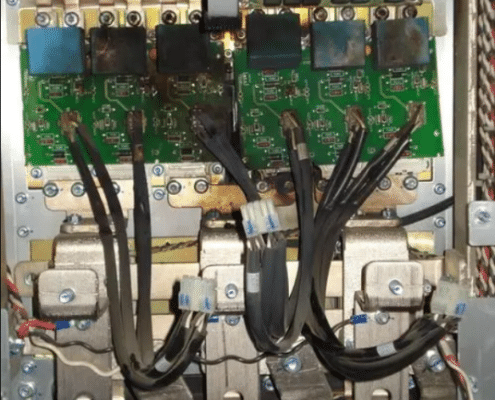 Smoke rising from a failed VFD with burn marks on internal components