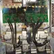 Smoke rising from a failed VFD with burn marks on internal components