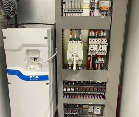 Drive display showing “Overcurrent Fault” alarm on a VFD